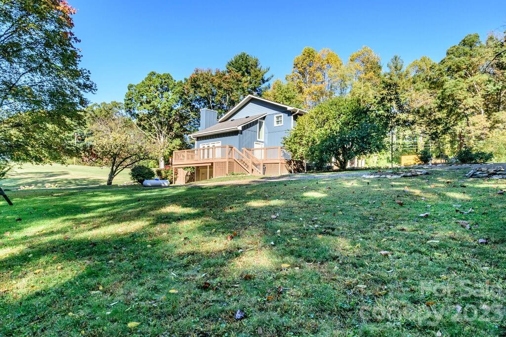 154 Rugby Drive Hendersonville, NC 28791 - Photo 45 of 48 a house view with a garden space