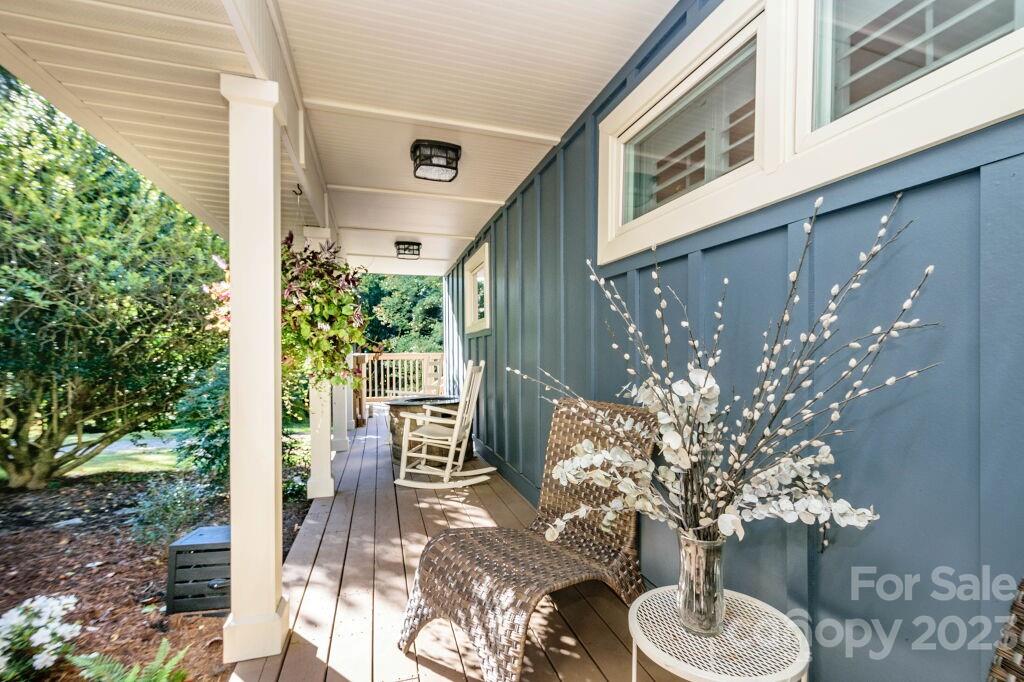 154 Rugby Drive Hendersonville, NC 28791 - Photo 48 of 48 a patio with table and chairs and potted plants