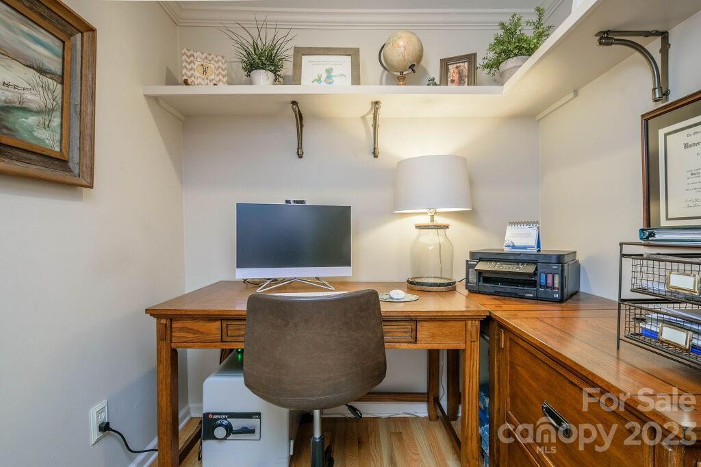 154 Rugby Drive Hendersonville, NC 28791 - Photo 6 of 48 a workspace with furniture and wooden floor