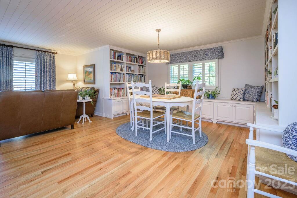 154 Rugby Drive Hendersonville, NC 28791 - Photo 8 of 48 a view of a dining room with furniture window and wooden floor