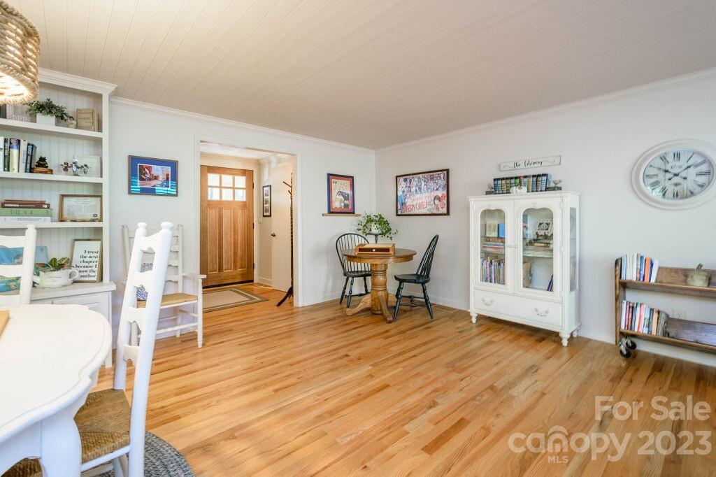 154 Rugby Drive Hendersonville, NC 28791 - Photo 9 of 48 a living room with furniture and a wooden floor