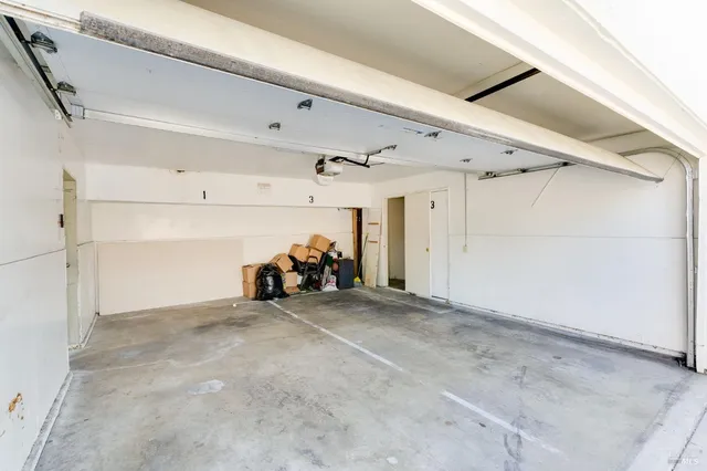 a view of a livingroom with furniture and a garage