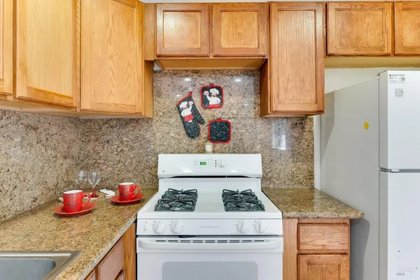 a kitchen with a stove and cabinets
