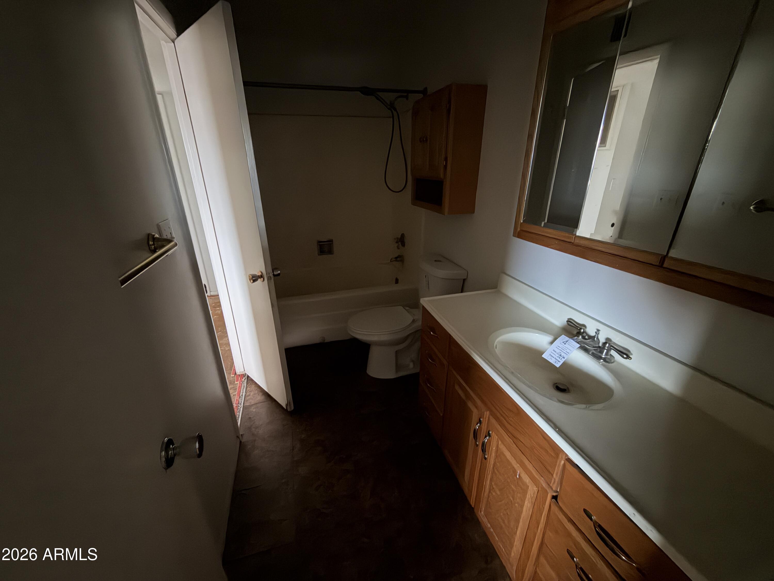 4356 West Ocotillo Road Glendale, AZ 85301 - Photo 13 of 16 a bathroom with a double vanity sink and mirror