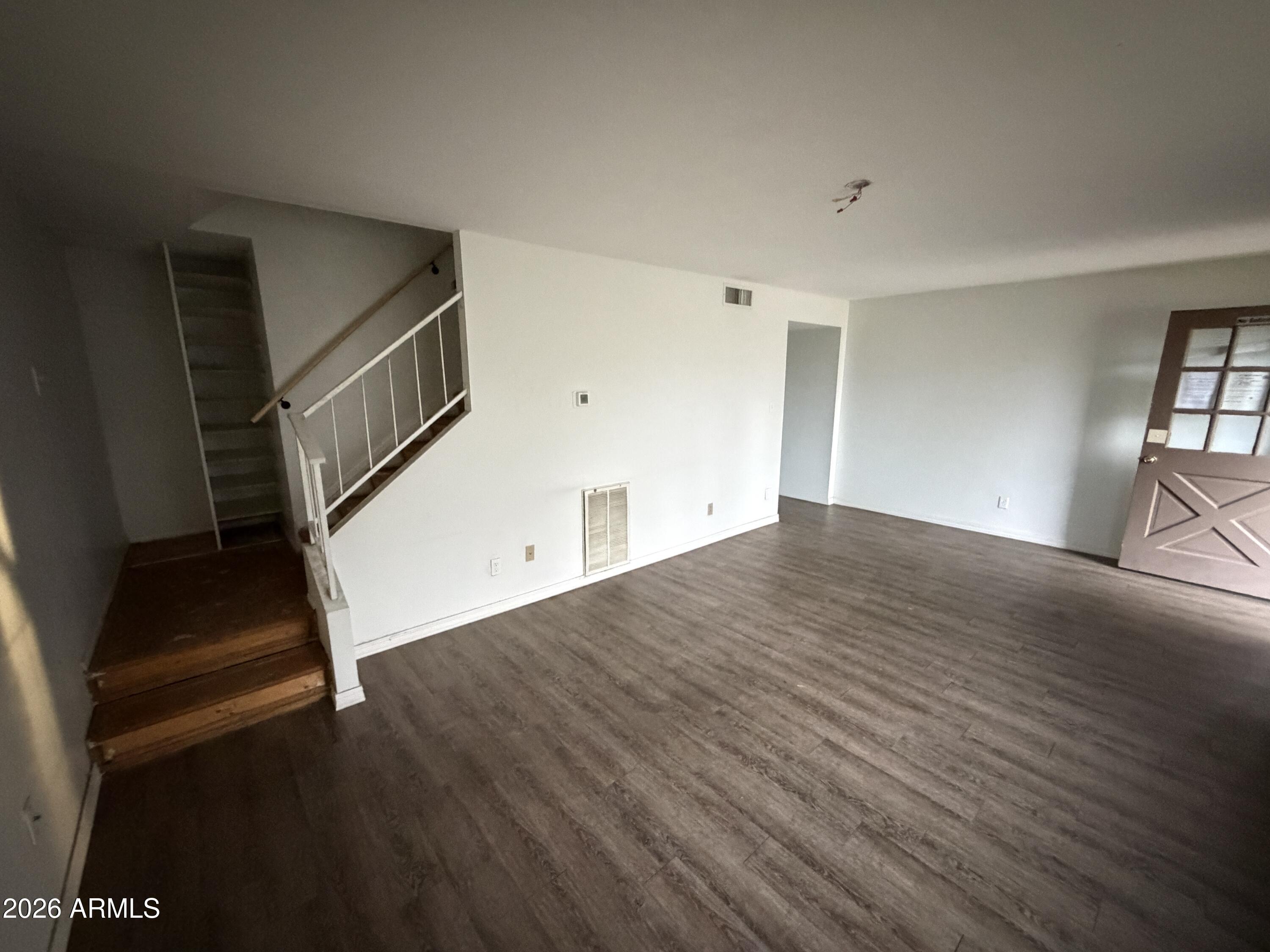 4356 West Ocotillo Road Glendale, AZ 85301 - Photo 3 of 16 a view of empty room with wooden floor and fan