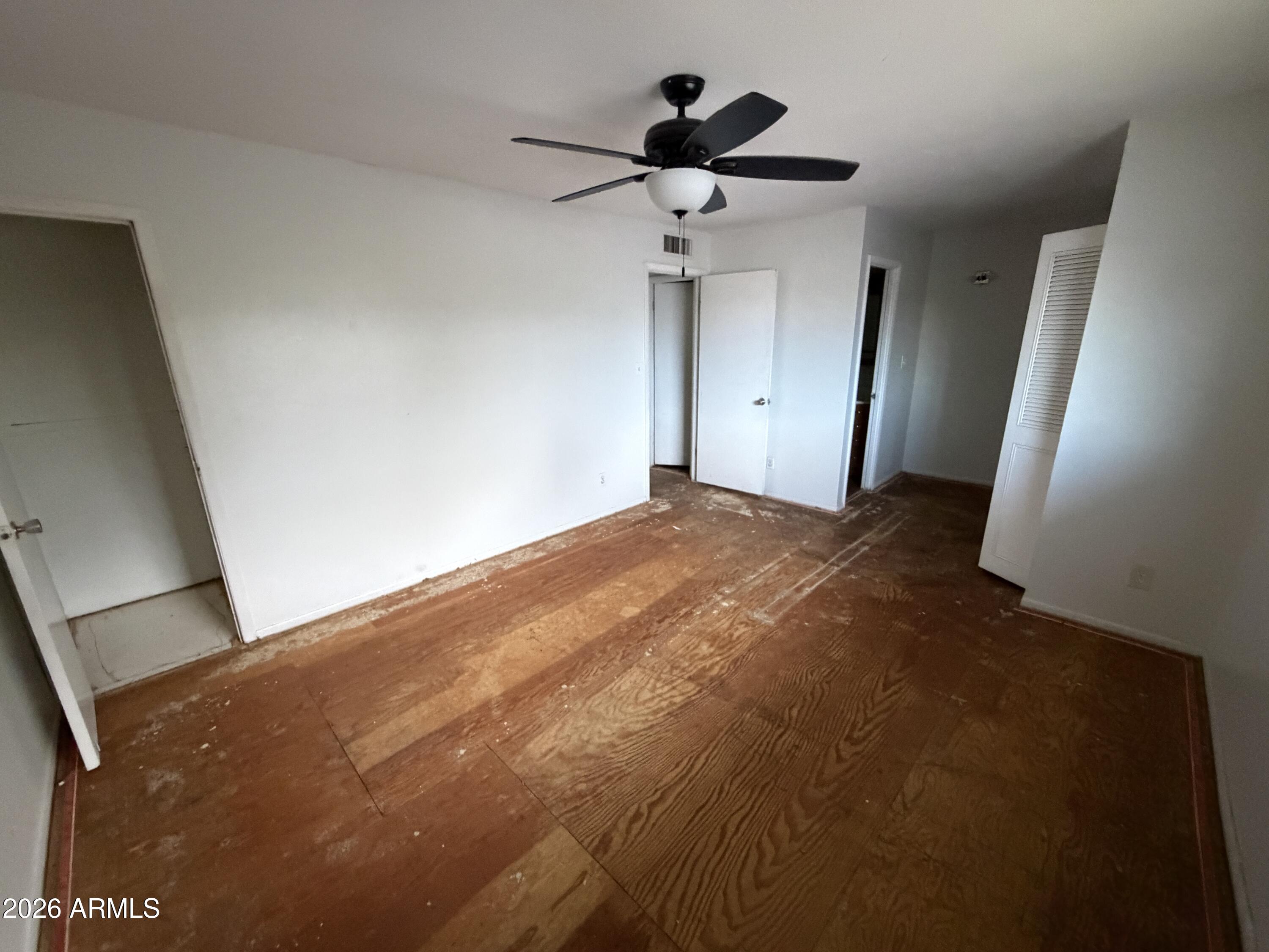 4356 West Ocotillo Road Glendale, AZ 85301 - Photo 8 of 16 a view of empty room with a ceiling fan and window