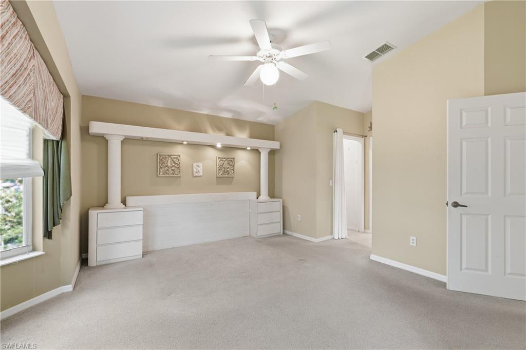 8055 Tiger Cove, Unit 608 Naples, FL 34113 - Photo 4 of 21 a view of an empty room with a window