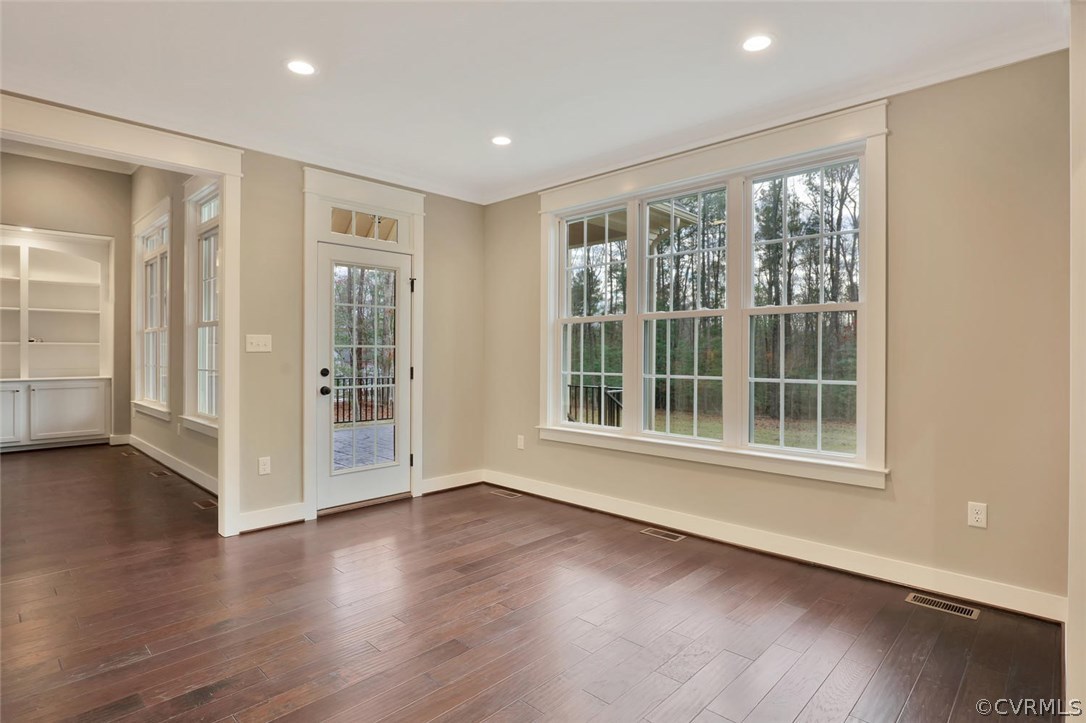 9201 Barrows Ridge Court Chesterfield, VA 23838 - Photo 16 of 35 a view of an empty room with wooden floor and a window