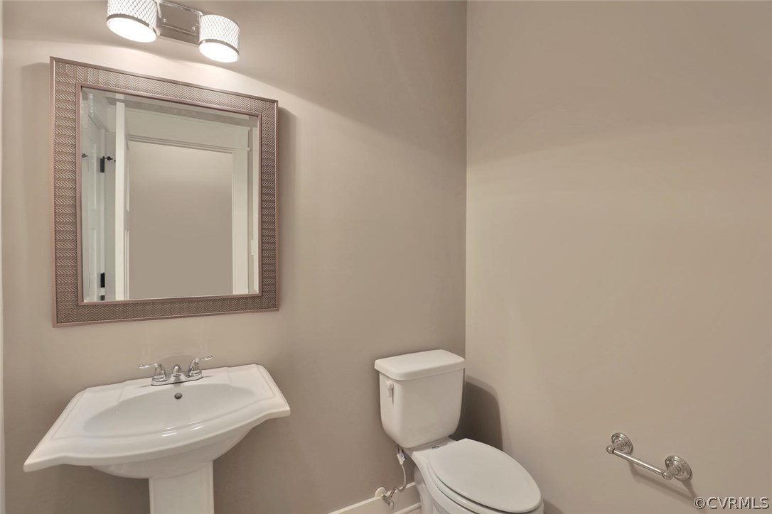9201 Barrows Ridge Court Chesterfield, VA 23838 - Photo 25 of 35 a bathroom with a toilet sink and mirror