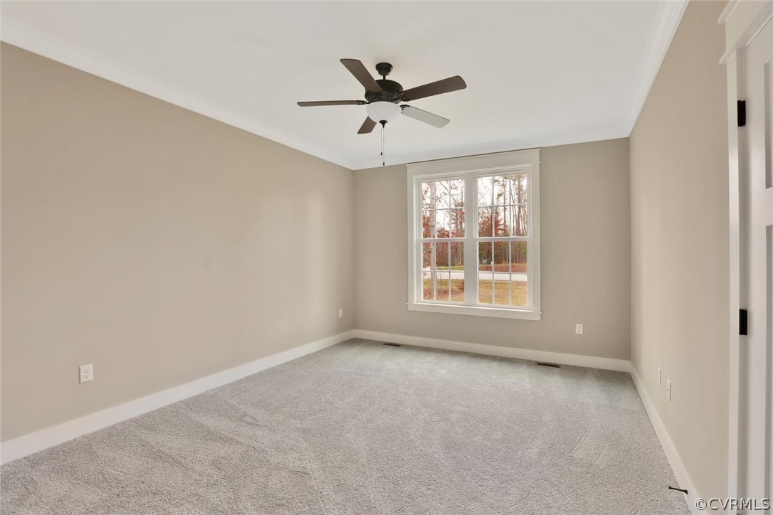 9201 Barrows Ridge Court Chesterfield, VA 23838 - Photo 26 of 35 a view of a livingroom with a ceiling fan & windows