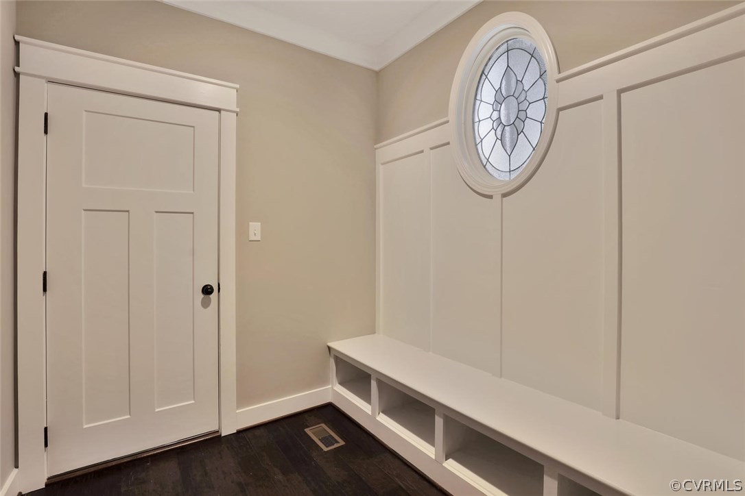 9201 Barrows Ridge Court Chesterfield, VA 23838 - Photo 29 of 35 a room with a wooden floor and a white cabinet