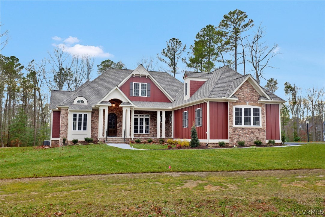9201 Barrows Ridge Court Chesterfield, VA 23838 - Photo 35 of 35 a front view of a house with a garden and trees