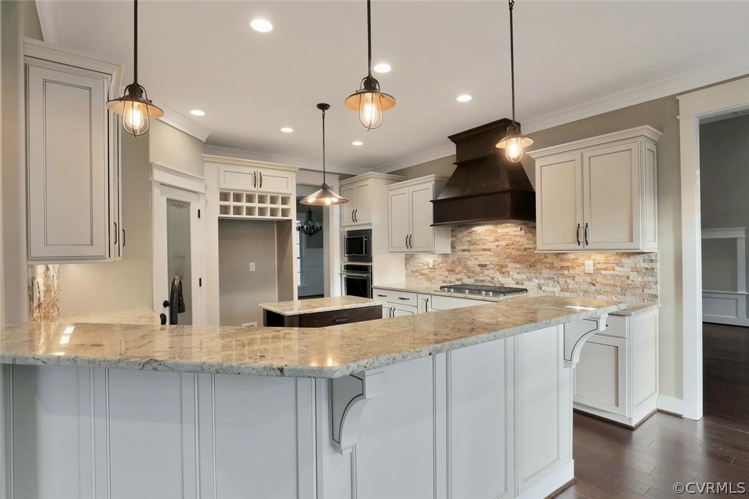 9201 Barrows Ridge Court Chesterfield, VA 23838 - Photo 10 of 35 a kitchen with kitchen island a sink and a stove