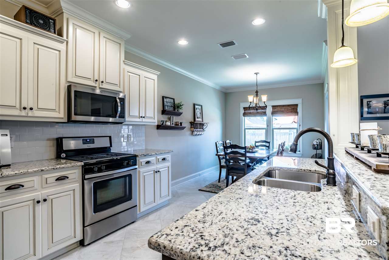 8686 Rosedown Lane Daphne, AL 36526 - Photo 9 of 29 Kitchen with stainless steel appliances.