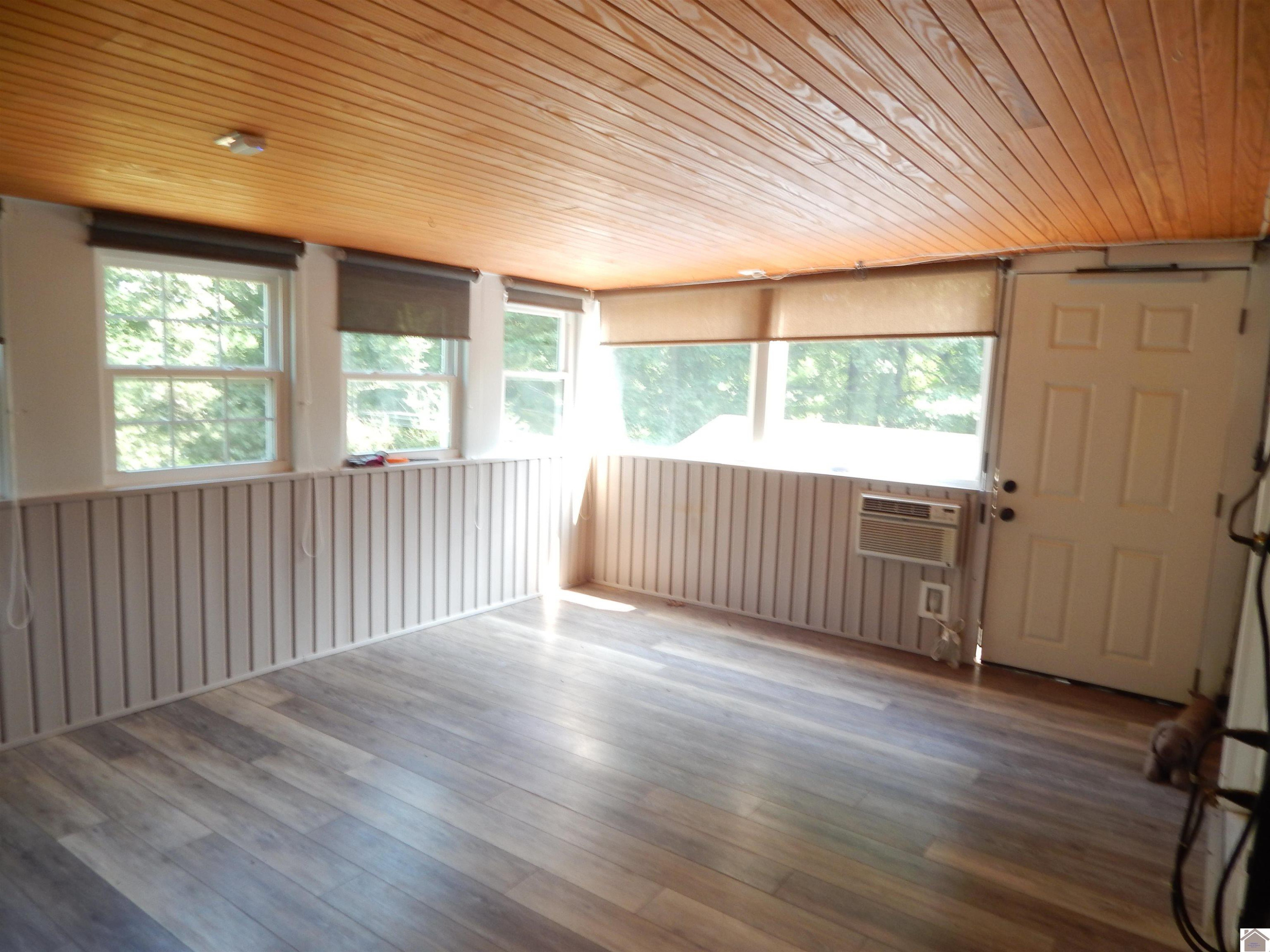 283 Delaware Road Gilbertsville, KY 42044 - Photo 22 of 35 MAIN FLOOR ENCLOSED HEATED/COOLED SUN ROOM