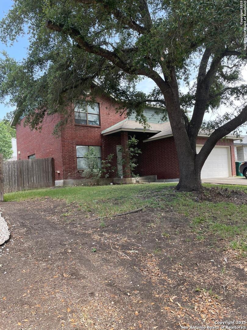 8039 Manderly Place Converse, TX 78109 - Photo 2 of 6 a view of a house with yard and a tree