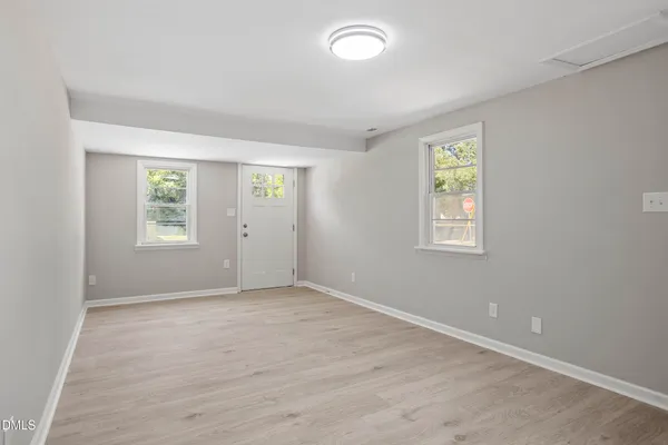 an empty room with windows