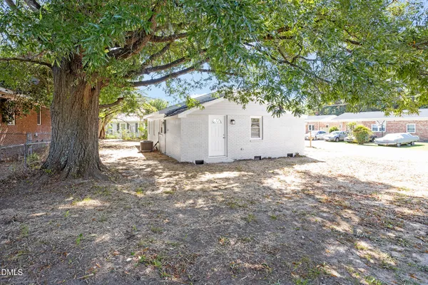 a view of a backyard of the house