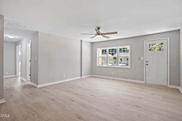 a view of an empty room with a window