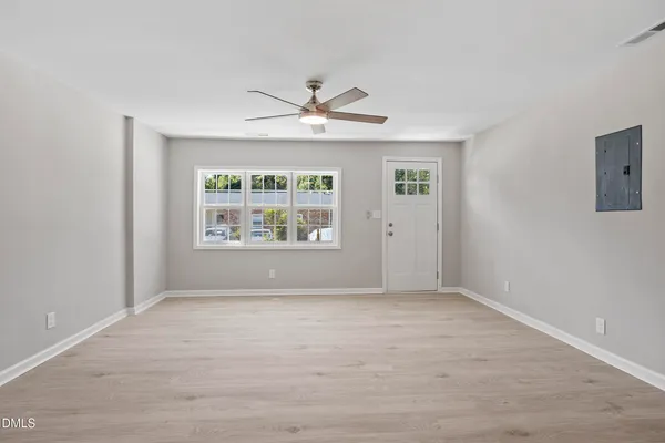 a view of an empty room with a window