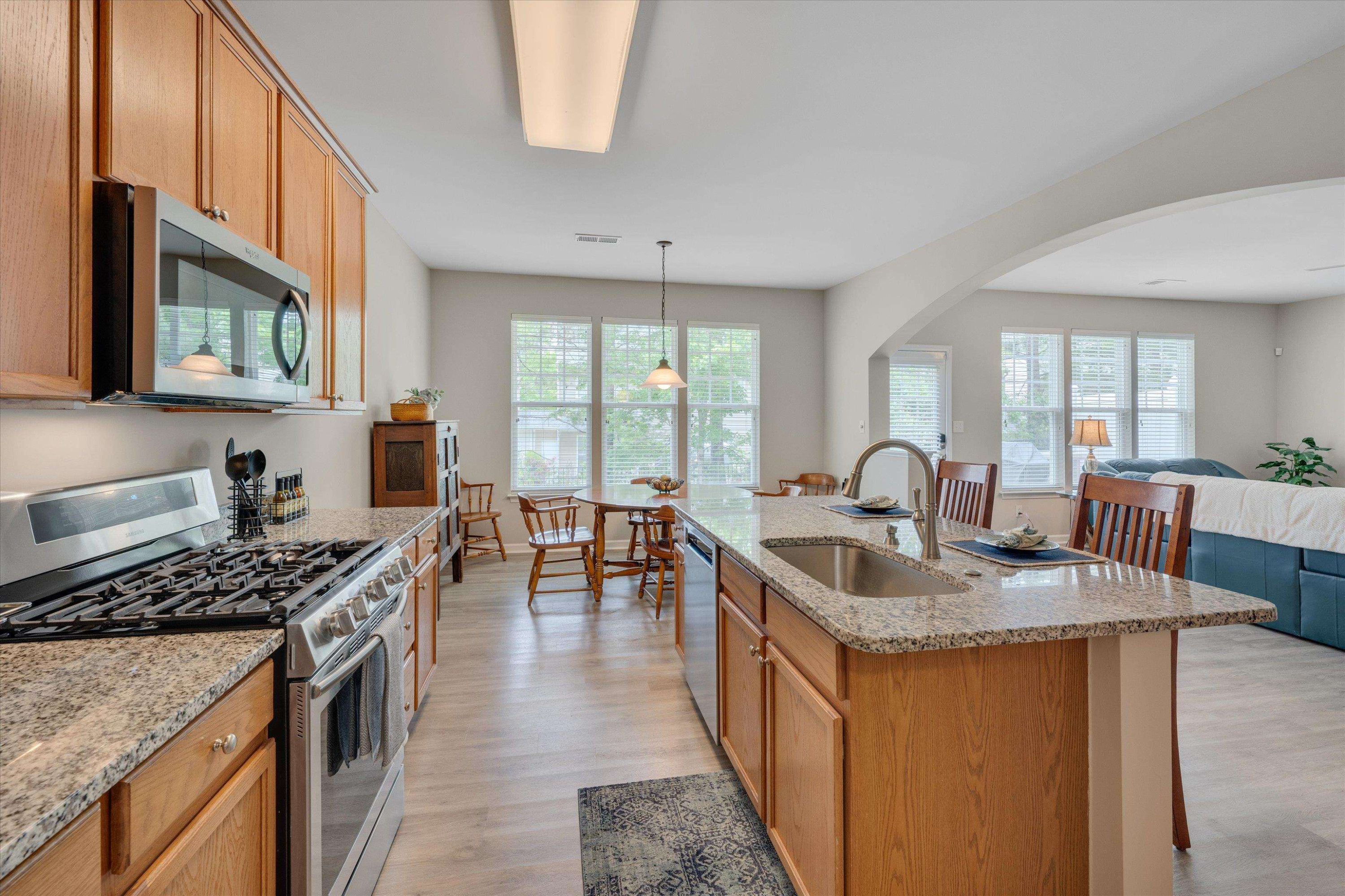 5 Gardenview Place Durham, NC 27713 - Photo 11 of 32 a kitchen with granite countertop a sink a counter top space and stainless steel appliances