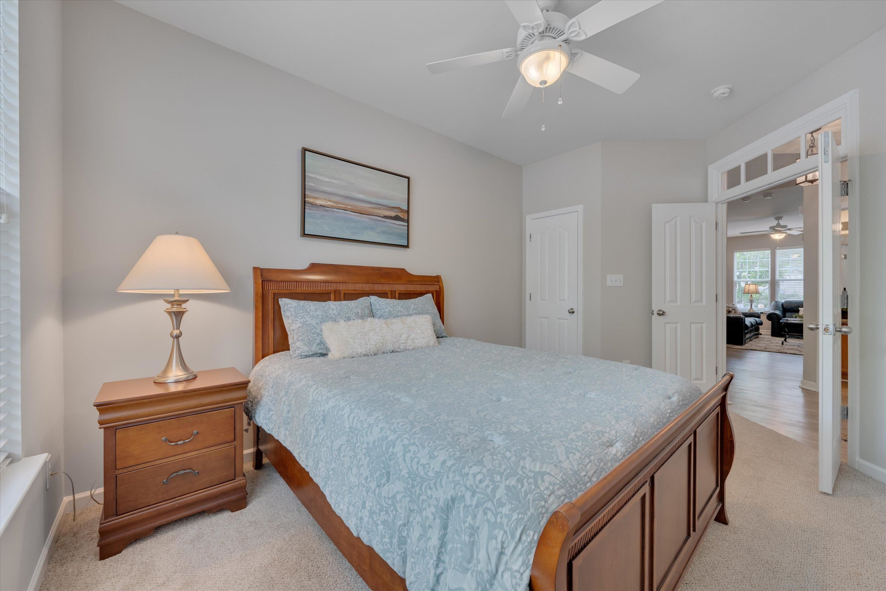 5 Gardenview Place Durham, NC 27713 - Photo 15 of 32 a bedroom with a bed and a lamp on table