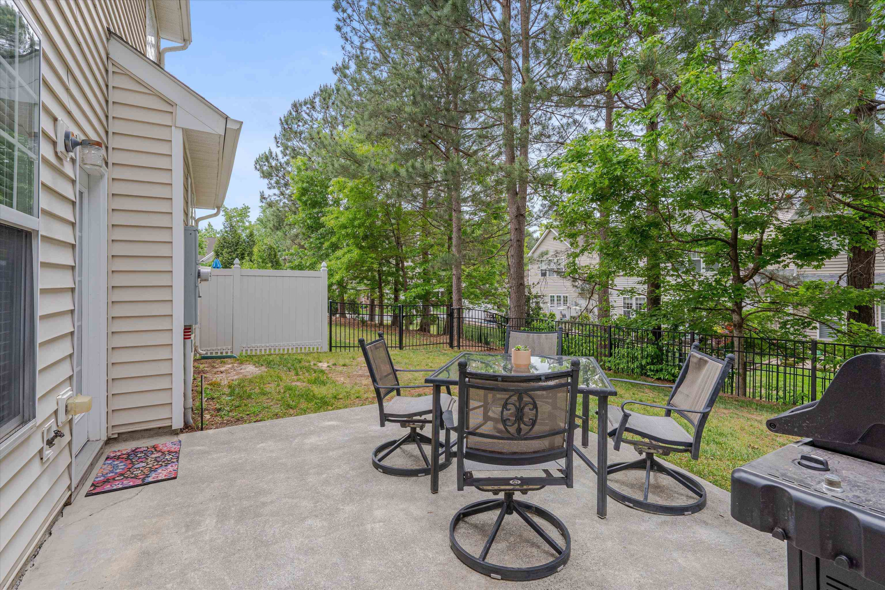 5 Gardenview Place Durham, NC 27713 - Photo 30 of 32 a view of a patio with table and chairs and potted plants
