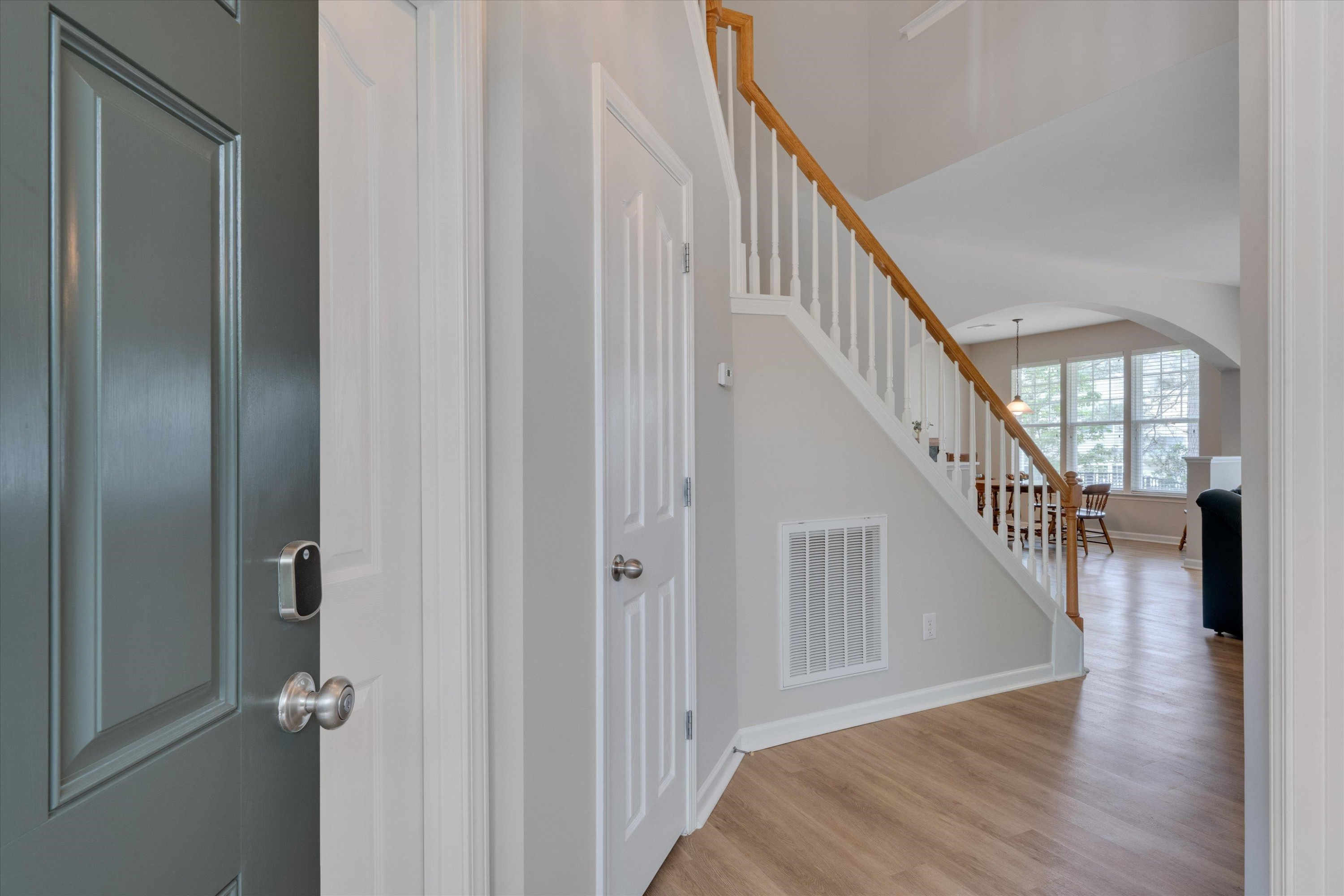 5 Gardenview Place Durham, NC 27713 - Photo 3 of 32 a view of staircase with lots of frames on wall and wooden floor
