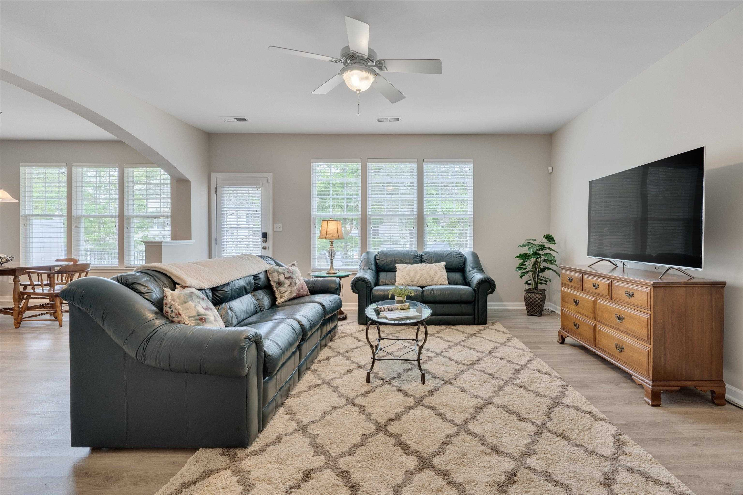 5 Gardenview Place Durham, NC 27713 - Photo 5 of 32 a living room with furniture and a flat screen tv