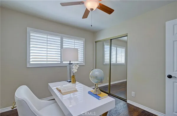 a work room with furniture and a window