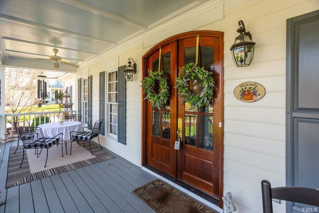a view of living room filled with furniture and wooden floor