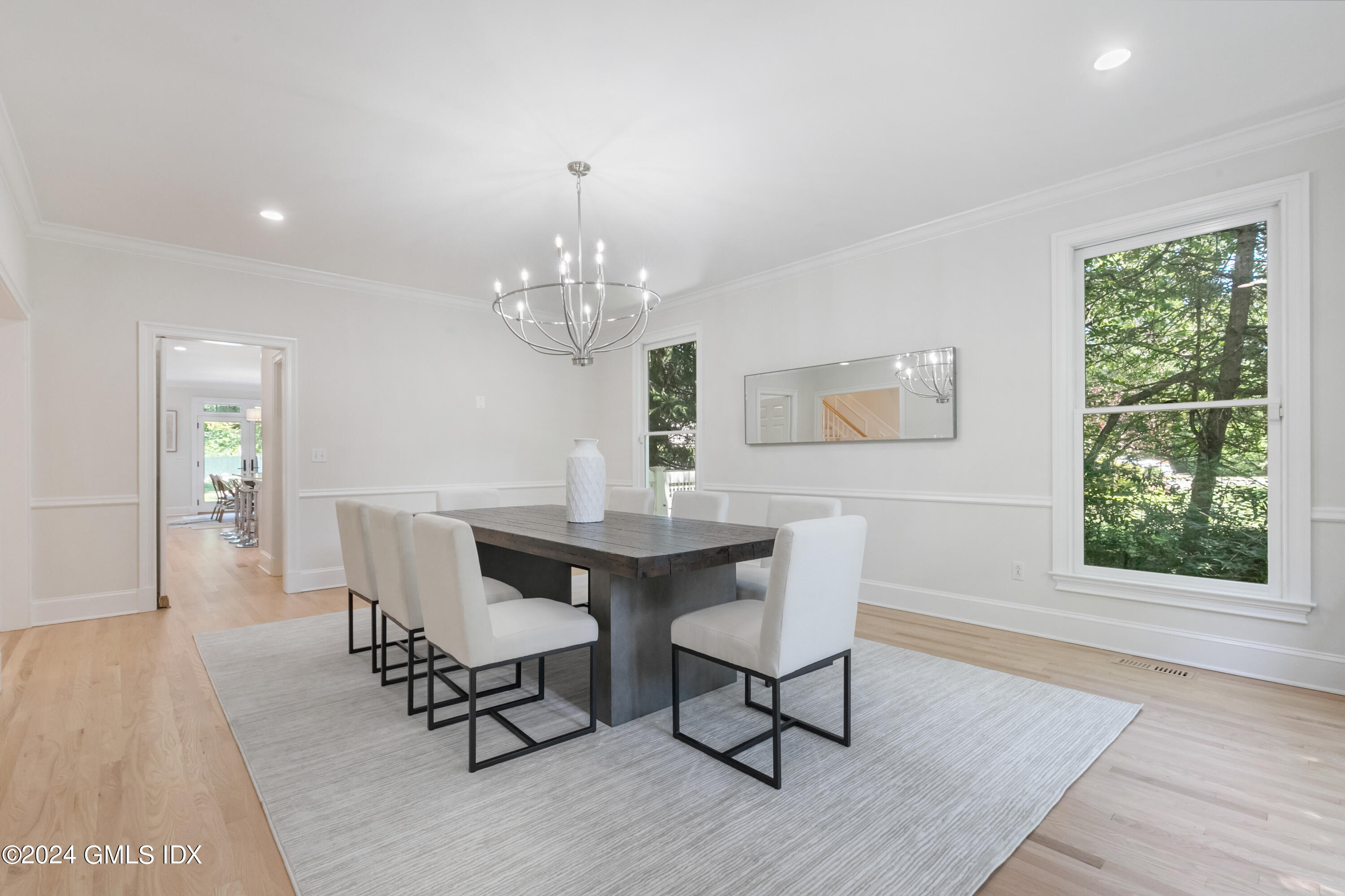 107 Summit Road Riverside, CT 06878 - Photo 12 of 47 a view of a dining room with furniture a rug and wooden floor