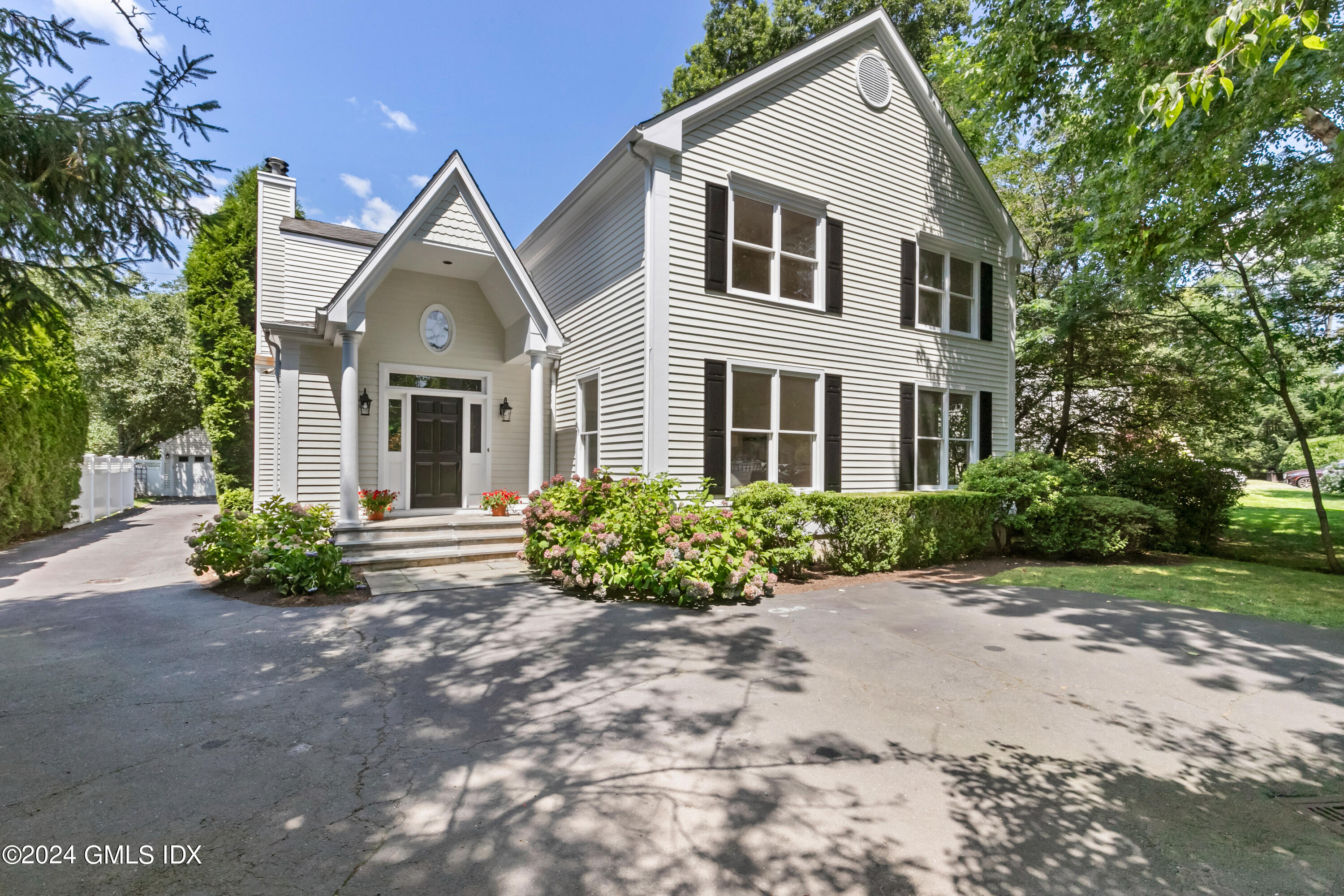 107 Summit Road Riverside, CT 06878 - Photo 2 of 47 a front view of a house with a yard