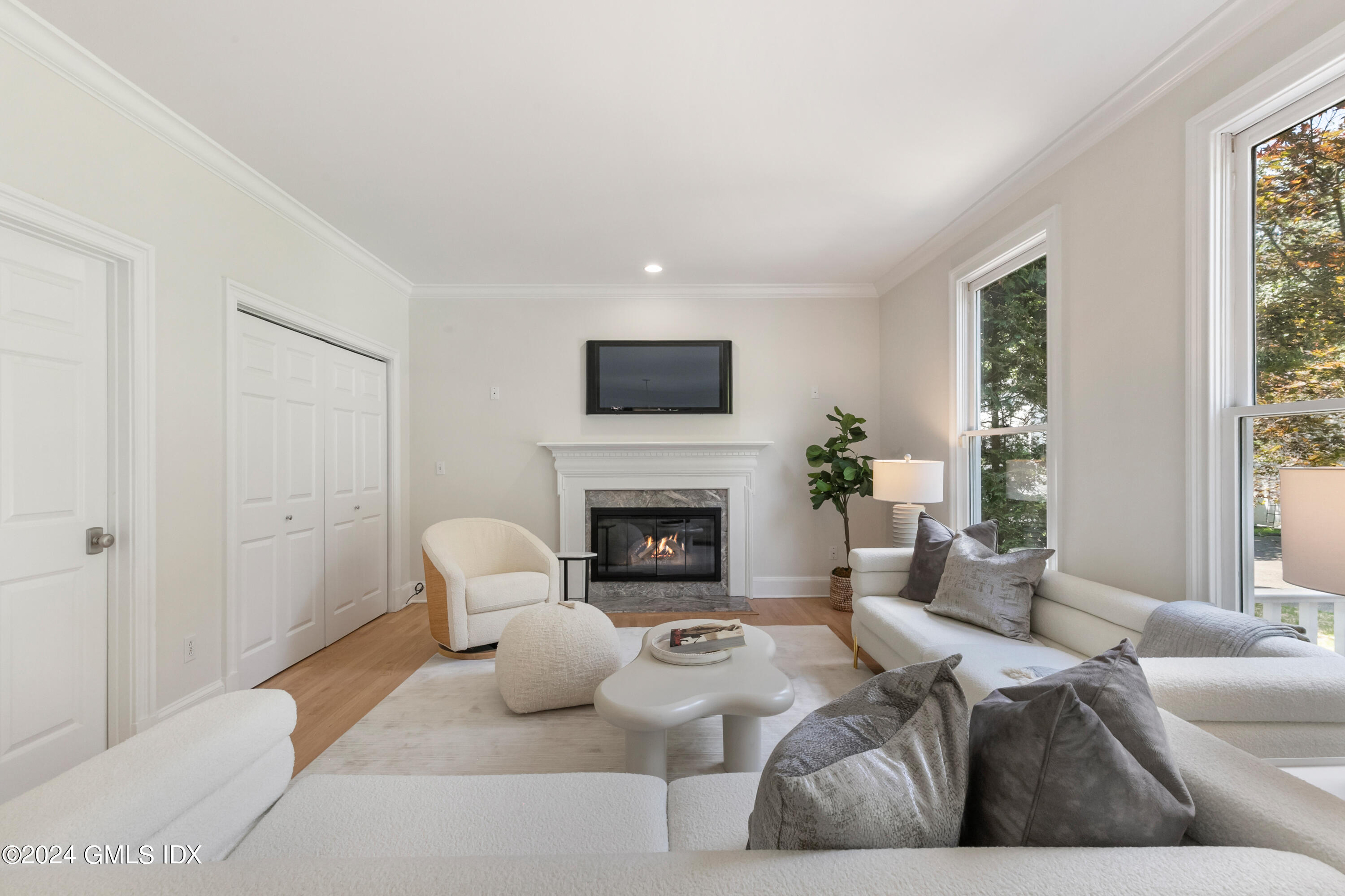 107 Summit Road Riverside, CT 06878 - Photo 23 of 47 a living room with furniture fireplace and window