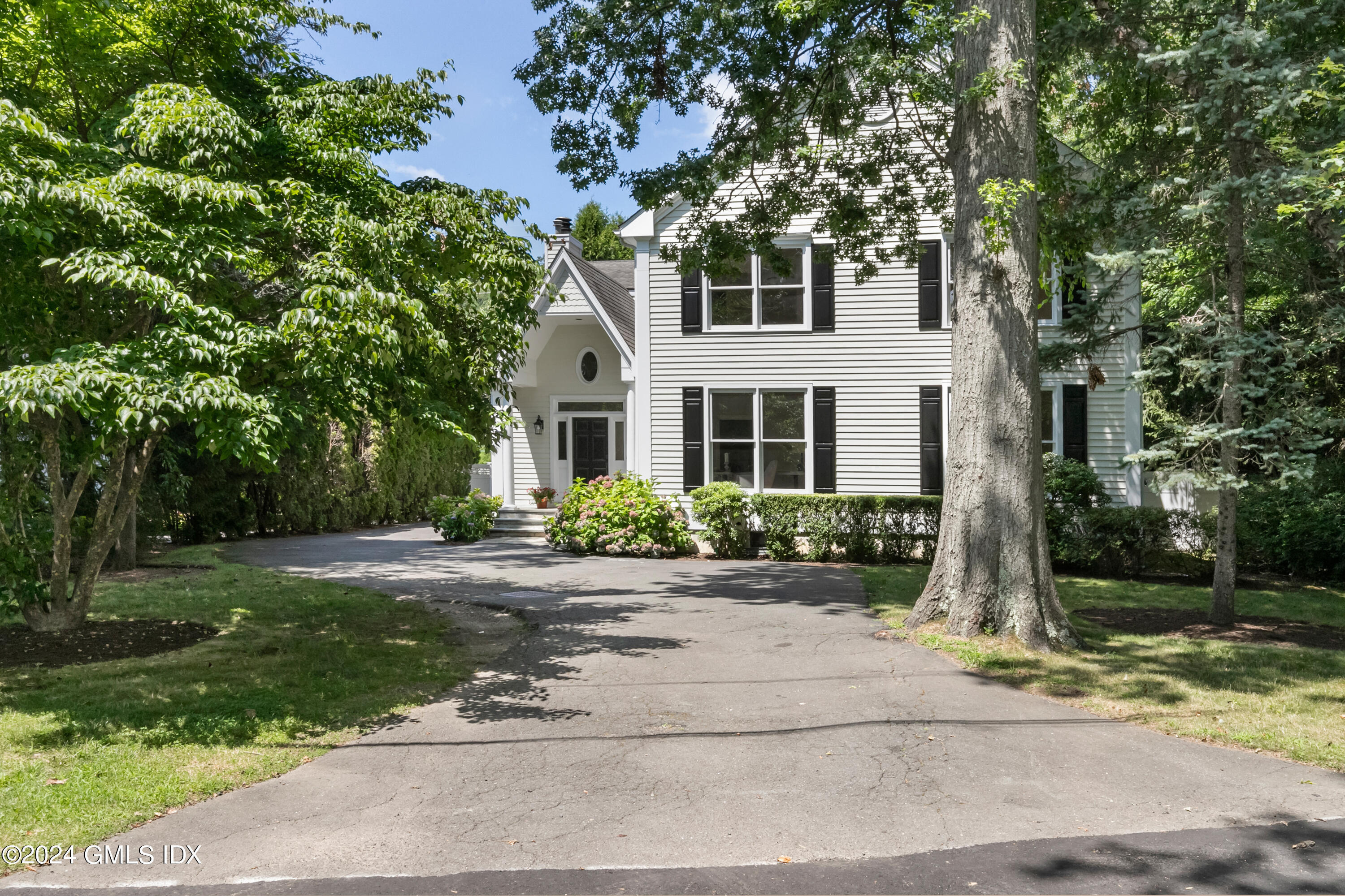 107 Summit Road Riverside, CT 06878 - Photo 36 of 47 front view of a house with a yard