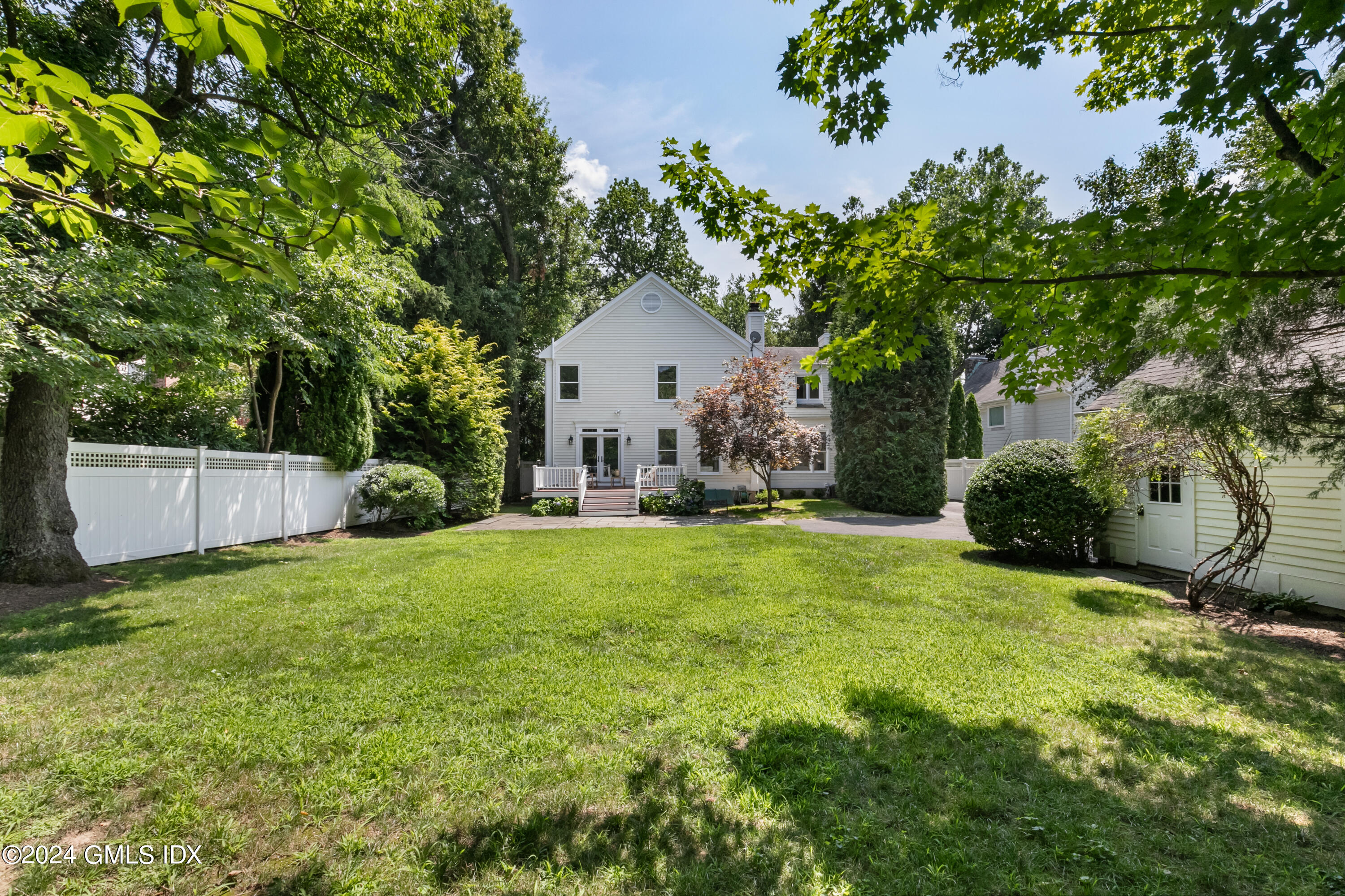 107 Summit Road Riverside, CT 06878 - Photo 43 of 47 a view of a house with backyard and a tree