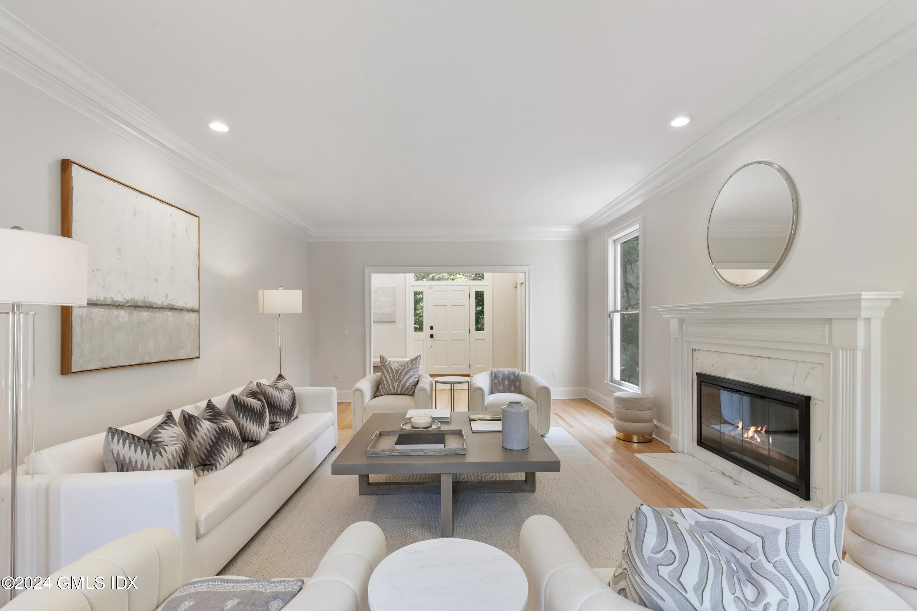 107 Summit Road Riverside, CT 06878 - Photo 9 of 47 a living room with furniture kitchen view and a fireplace