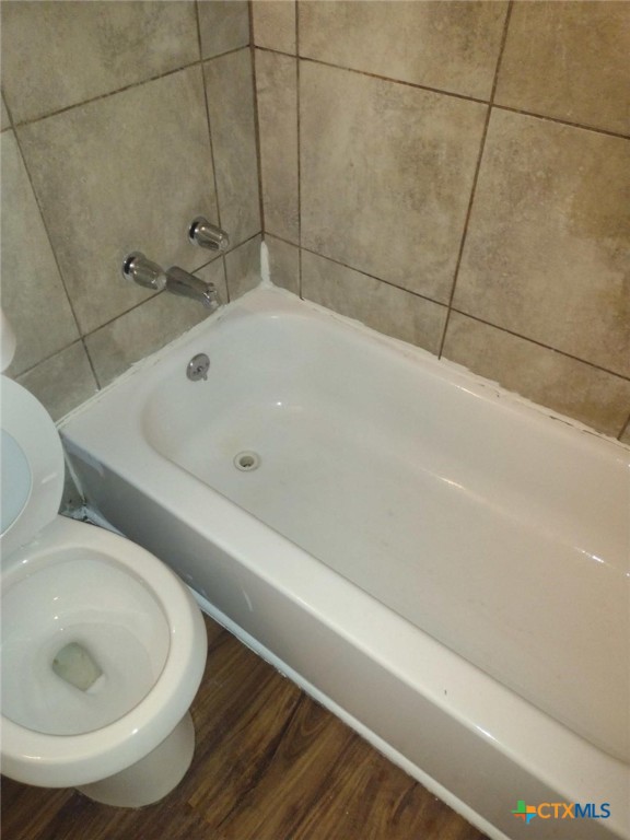 2505 Reuter Avenue, Unit 2505 Waco, TX 76708 - Photo 6 of 10 a bathroom with a tub and a shower