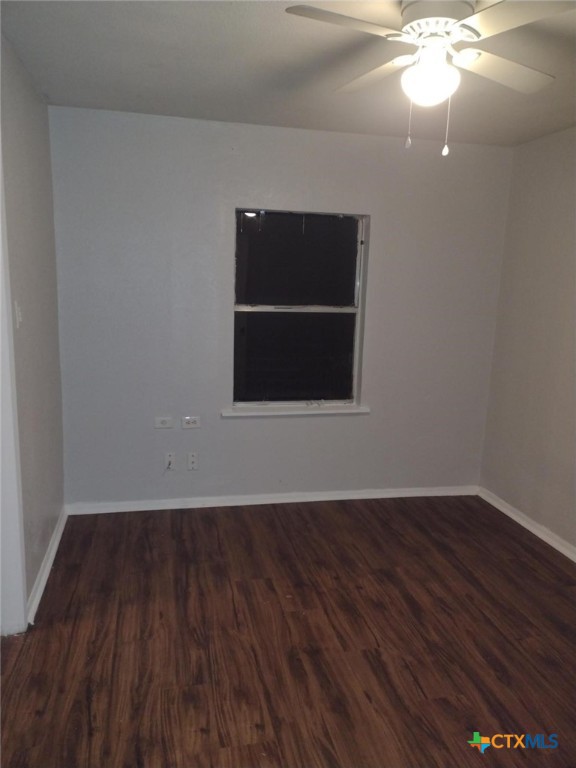 2505 Reuter Avenue, Unit 2505 Waco, TX 76708 - Photo 10 of 10 a view of an empty room with wooden floor and a window