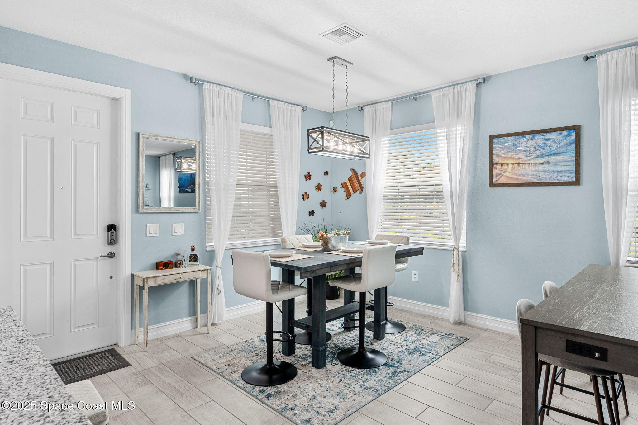 1810 Noel Place, Unit 107 Melbourne, FL 32935 - Photo 17 of 59 a view of a dining room with furniture