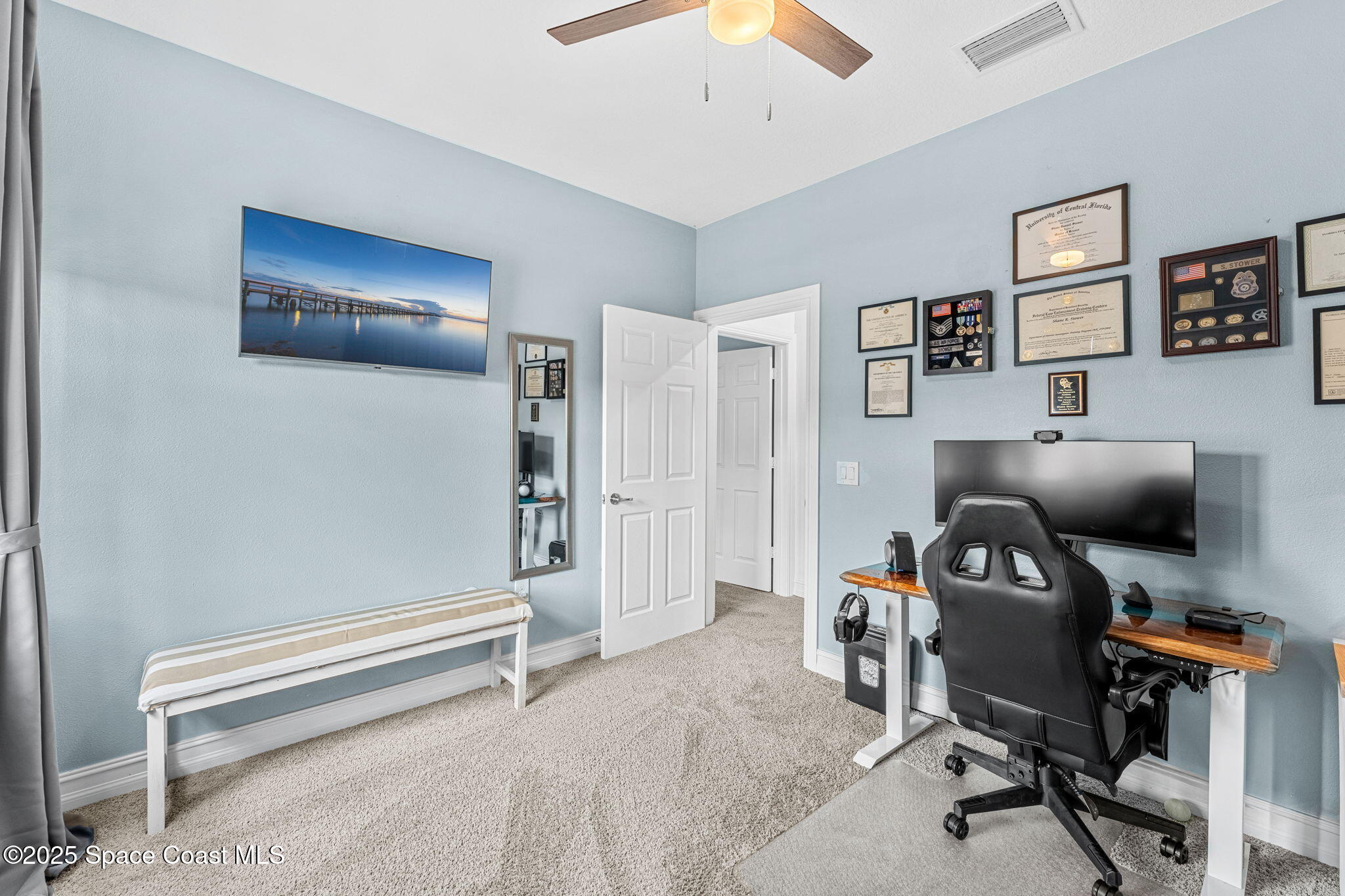 1810 Noel Place, Unit 107 Melbourne, FL 32935 - Photo 34 of 59 a livingroom with workspace and a window