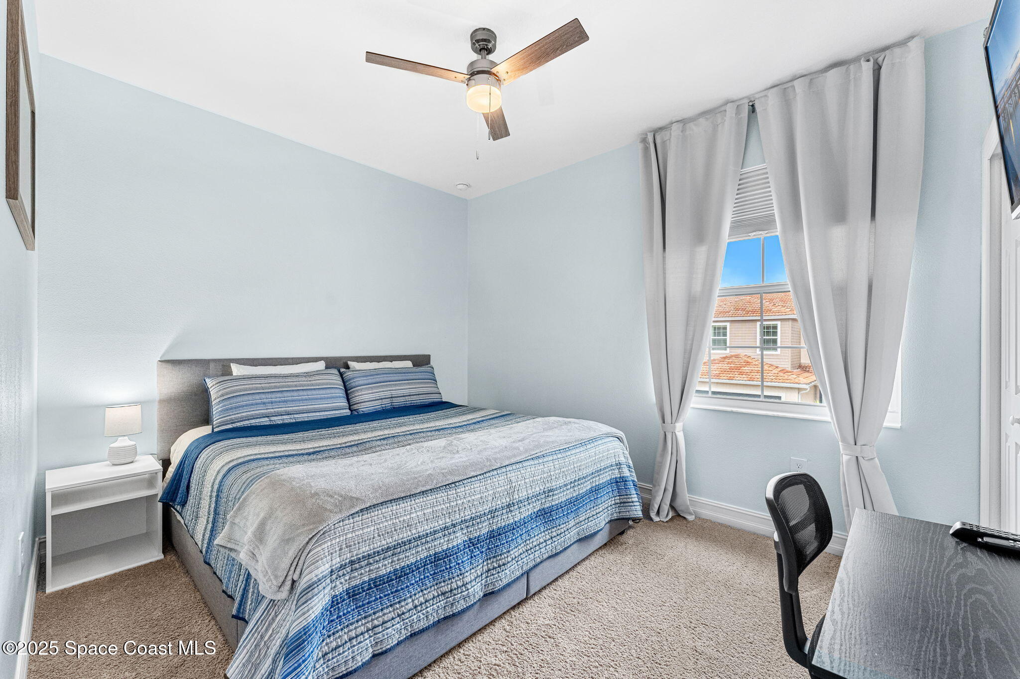 1810 Noel Place, Unit 107 Melbourne, FL 32935 - Photo 35 of 59 a bedroom with a bed and a window