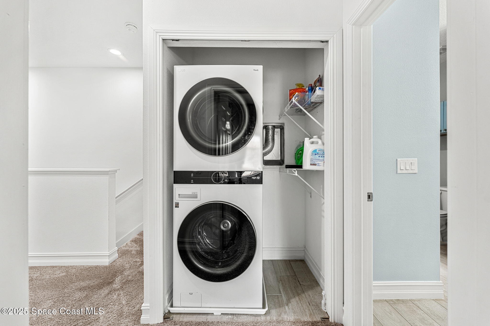 1810 Noel Place, Unit 107 Melbourne, FL 32935 - Photo 39 of 59 a view of a hallway with washer and dryer
