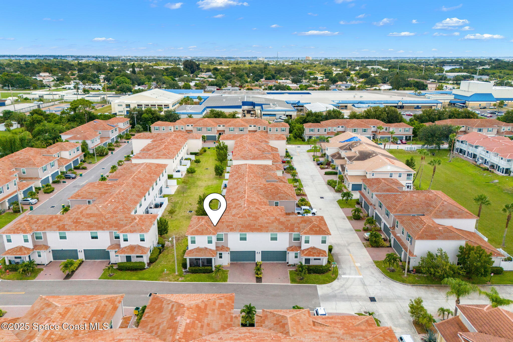 1810 Noel Place, Unit 107 Melbourne, FL 32935 - Photo 45 of 59 an aerial view of residential building and lake