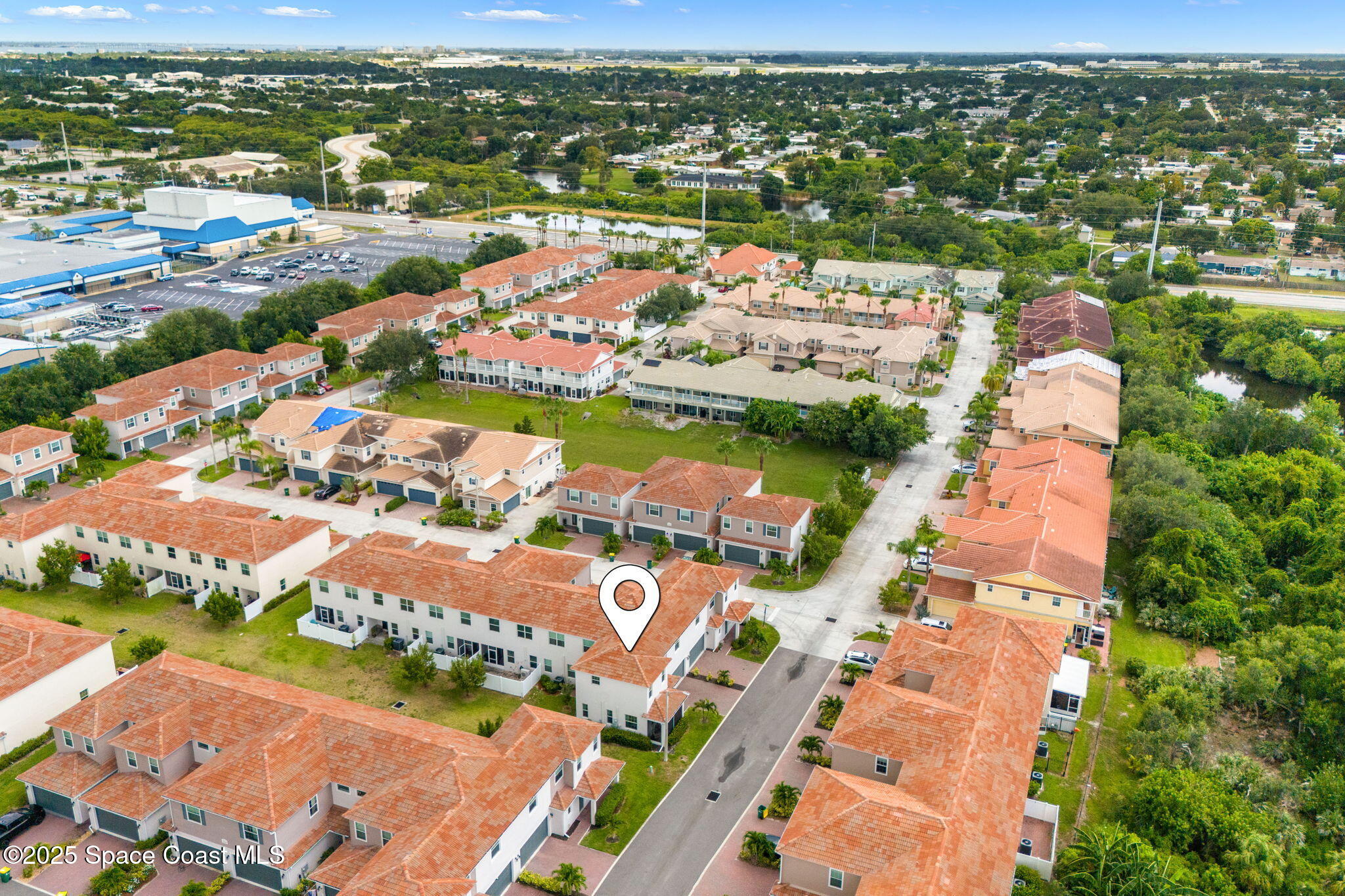 1810 Noel Place, Unit 107 Melbourne, FL 32935 - Photo 49 of 59 an aerial view of residential houses with outdoor space