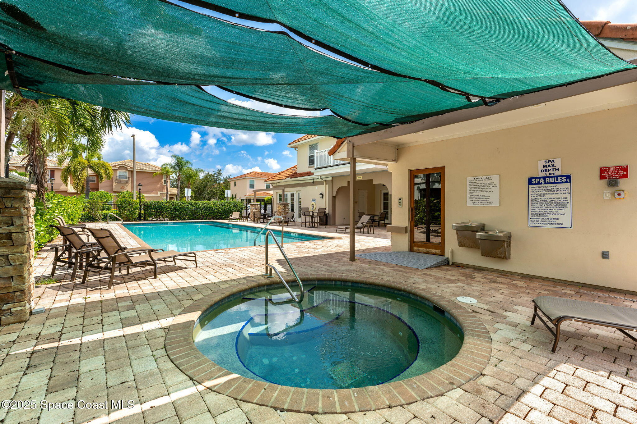 1810 Noel Place, Unit 107 Melbourne, FL 32935 - Photo 55 of 59 a view of a swimming pool with a patio