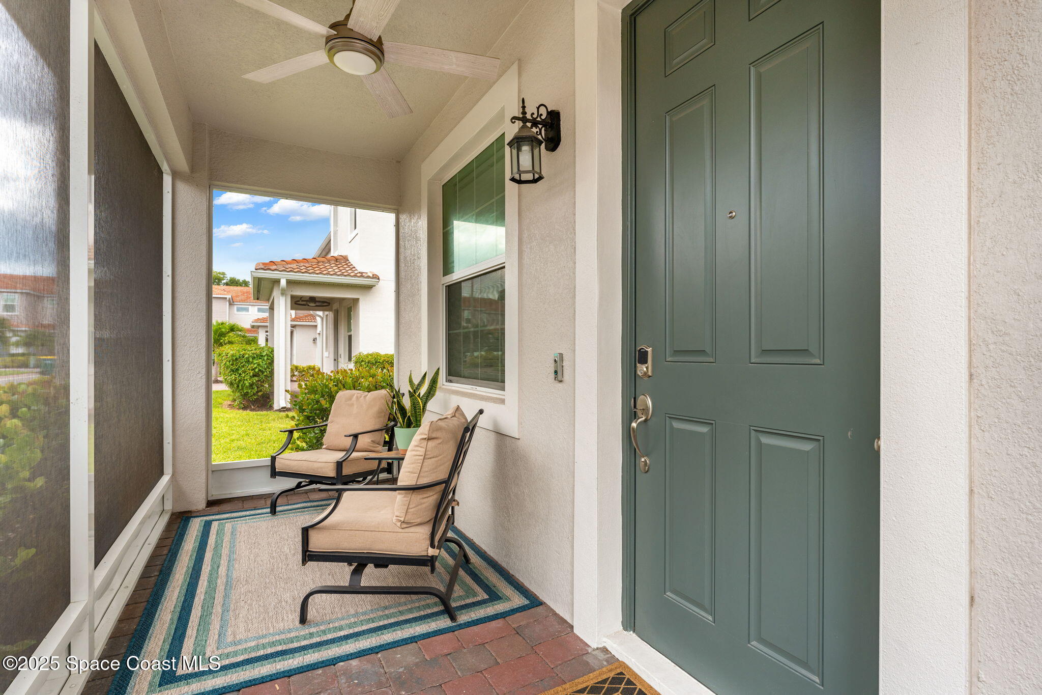 1810 Noel Place, Unit 107 Melbourne, FL 32935 - Photo 6 of 59 a view of a balcony with furniture and a potted plant