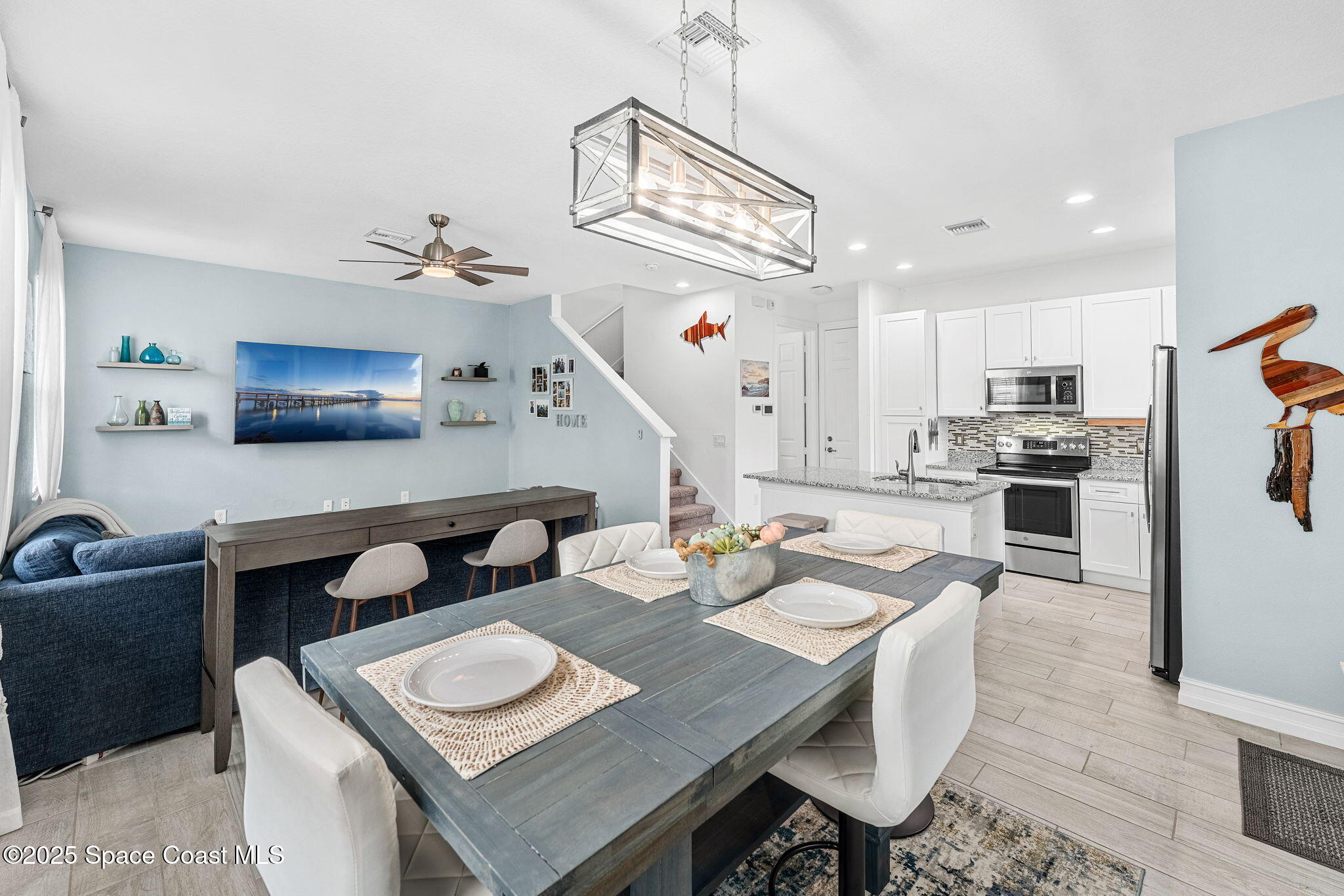 1810 Noel Place, Unit 107 Melbourne, FL 32935 - Photo 10 of 59 a view of a dining room with furniture and a kitchen