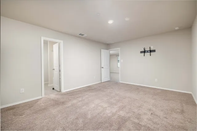 a bathroom with a granite countertop tub sink and mirror