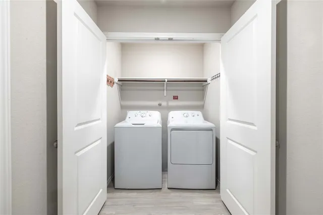 a utility room with dryer and washer